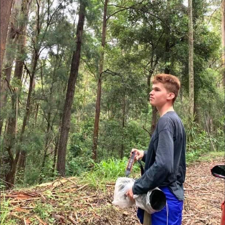 Young man in the woods.