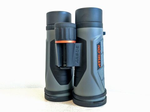 Dark and light gray binoculars with orange details.