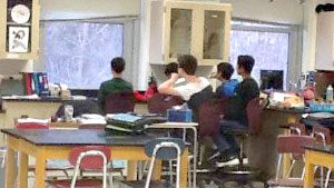 Students in Jennifer Ford's classroom (Farnsworth Middle School, Guilderland, New York) count birds for FeederWatch. They are so engaged, she had to create a sign-up sheet to ensure everyone gets a window seat! Photo by Jennifer Ford.