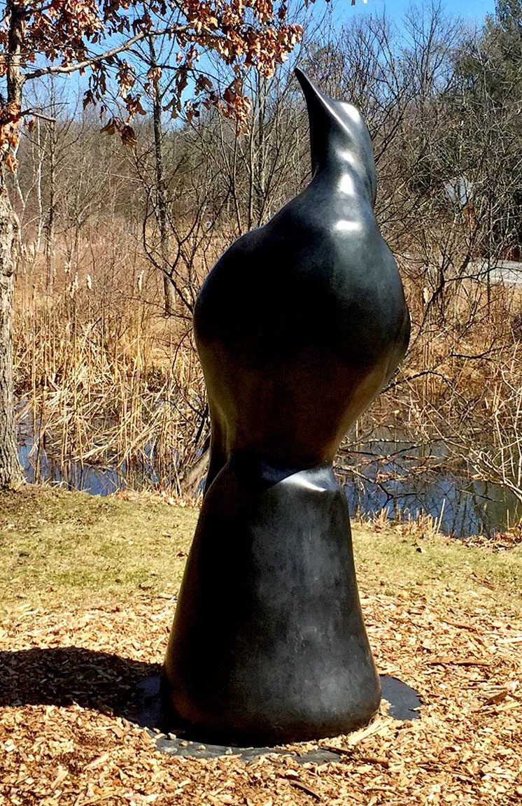 Modern sculpture of a bird in black material